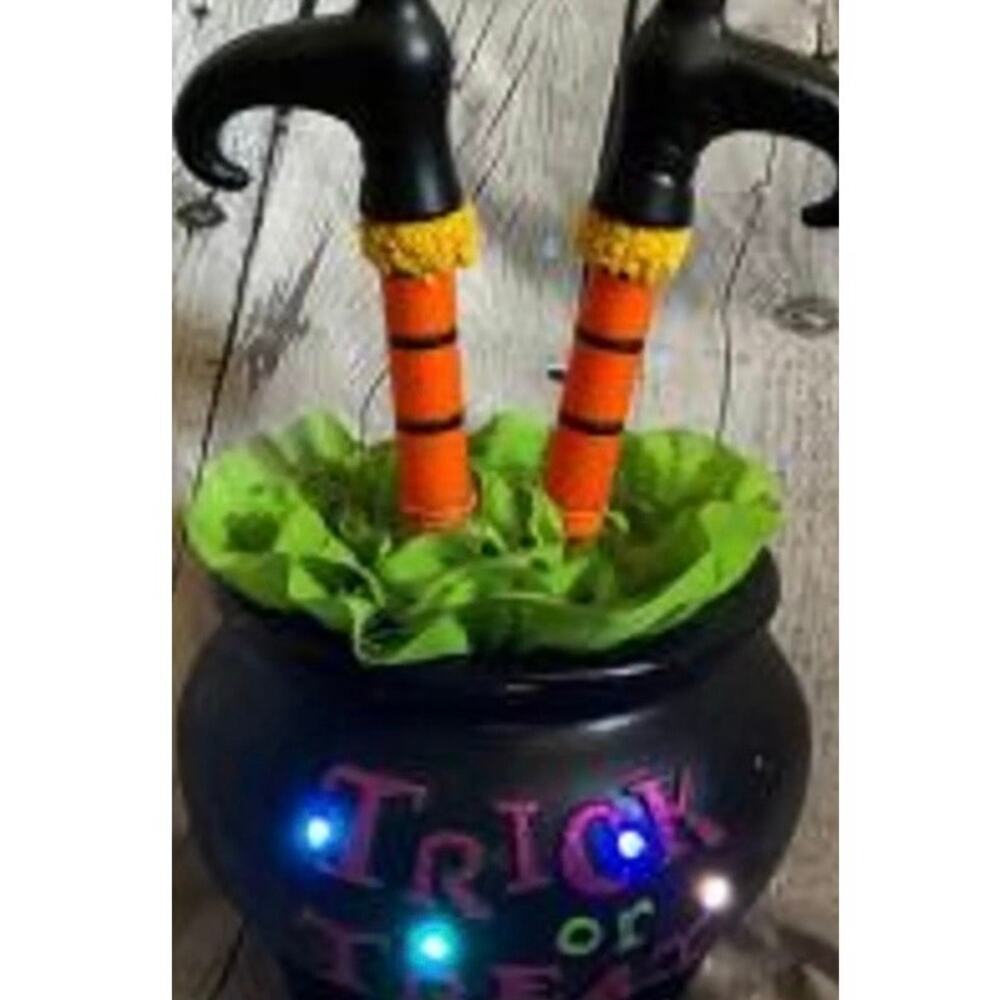 Halloween witch leg cauldron w/black pot labeled "Trick or Treat" tested & works